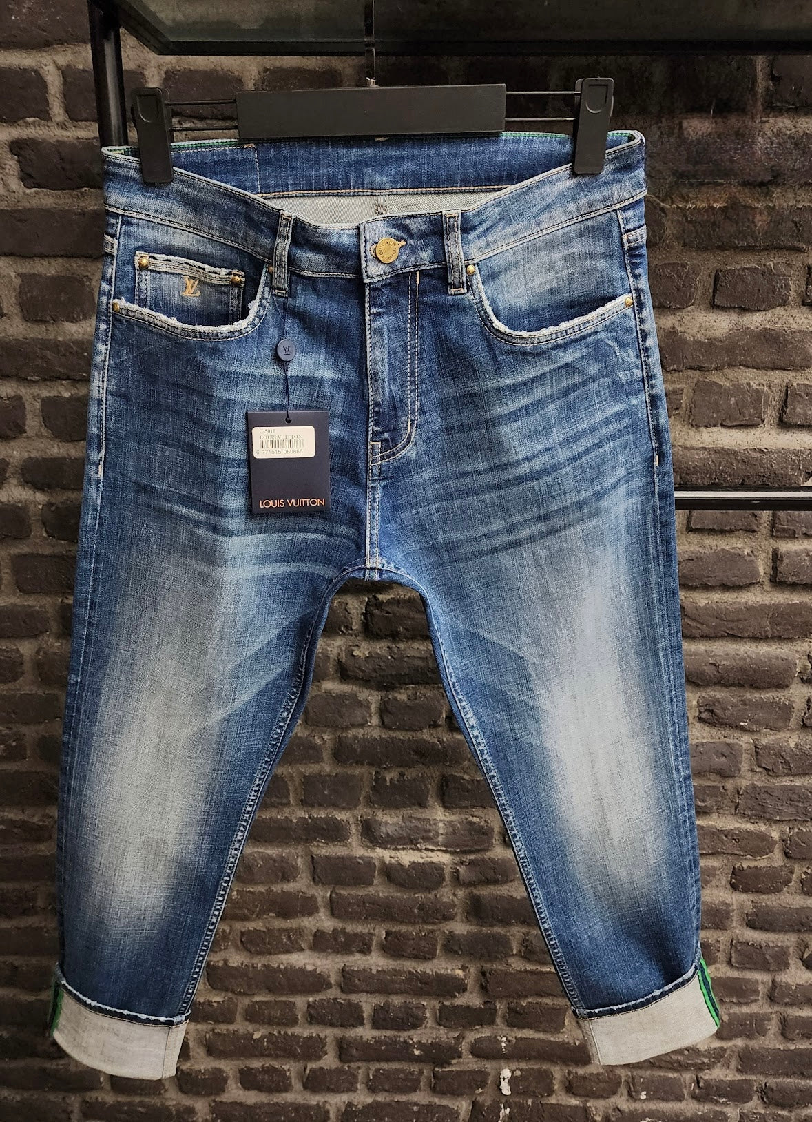 Distressed Blue Denim Jeans with Green Louis Vuitton Patch