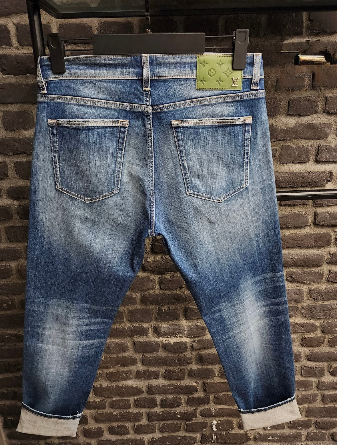 Distressed Blue Denim Jeans with Green Louis Vuitton Patch